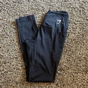 Size small black gymshark leggings with side pockets and mesh down side of legs